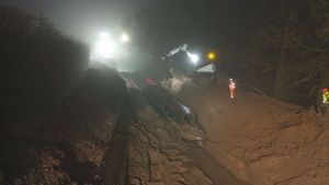 The final stricken canal boat, Sefton, being winched from the Whitchurch breach. Picture: Court Above the Cut