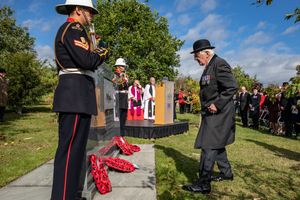 Paying respects at the memorial.
