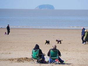 People on the beach at Weston-super-Mare in North Somerset.