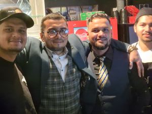 Abdul (L) and Harry (in glasses) with staff from Kaptin Korma