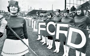 nostalgia pic. Telford. 'Telford's drum majorette troupe made a rehearsal appearance at the Buck's Head last night before their big date for the FA Challenge Trophy semi-final on Saturday.\ That's the caption pasted on the back of this print from the Shropshire Star picture archive, which has the Shropshire Star copyright stamp. Handwritten date on the back is 30.3.71, i.e. March 30, 1971. That is likely publication date. There is also a datestamp on the back for September 17, 1971, which is probably when it was republished for some reason. Telford United Football Club. Cheerleaders. Library code: Telford nostalgia 2013.