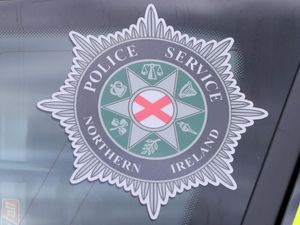 PSNI badge on a car