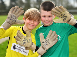 Goalkeepers Finlay Puttergill and Luke Joyce show off the gloves given to them by Jackson Smith