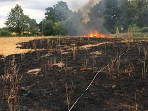 Firefighters tackling the grass fire. Picture: Bridgnorth Fire Station