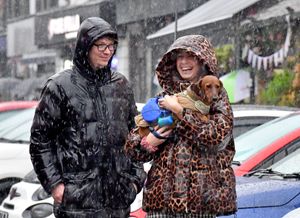 Visitors to the Bridgnorth Italian Moto Fest brave the horrendous downpours to view the cars on show