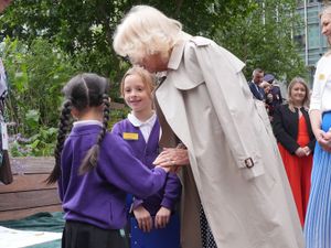 Supporting image for story: Queen ‘warms up’ six-year-old girl’s ‘cold hands’ during blustery outdoor event