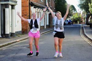 Kaci-Leigh Thomas (left) and Emily Scott-Perry are all smiles as they near the finishing line.