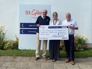 Lion President Mike Knight and Tony Twist of Whittington Heath Golf Club recently presented a cheque for £10,226.95 to St Giles.