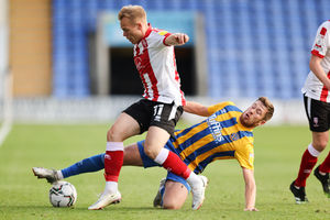 Anthony Scully in action for Lincoln City, where he enjoyed a prolific spell under Michael Appleton, up against former Town midfielder Josh Vela. (AMA)