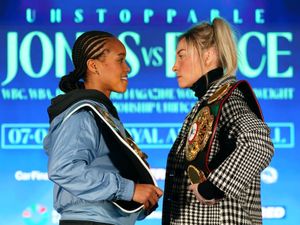 Natasha Jonas, left, and Lauren Price face off carrying their title belts during a press conference in January to promote Friday's fight