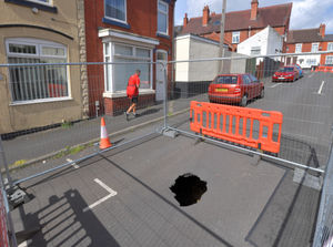 The hole that appeared in the middle of Brick Kiln Street in Quarry Bank in 2022