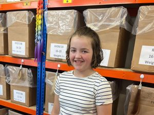 Supporting image for story: Girl who cut off 13 inches of hair to make cancer wig eyes world record