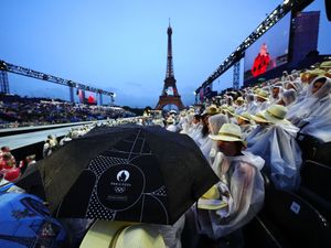 Supporting image for story: Rain puts a dampener on the Paris Olympics opening ceremony down the River Seine