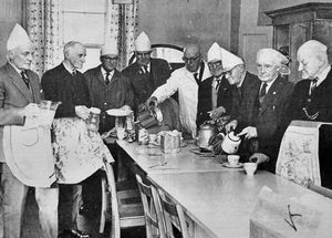 February 1968, the caption reads: 'Members of Hadley Old Folk's Association preparing a meal for the women members at a Men's Day party at the Hadley Rest Room.' 