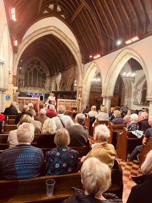 The audience enjoying Lesley Smith's performance of Elizabeth I at St Marys Church, Colton. 