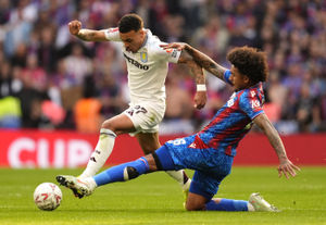 Aston Villa's Morgan Rogers and Crystal Palace's Chris Richards battle for the ball during the Emirates FA Cup semi-final match at Wembley Stadium, London. Picture date: Saturday April 26, 2025.