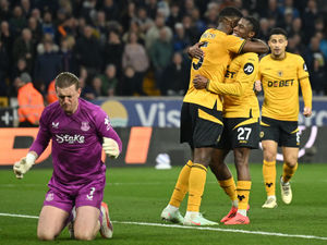  Jordan Pickford reacts as Wolverhampton Wanderers' Zimbabwean midfielder #05 Marshall Munetsi celebrates (Photo by JUSTIN TALLIS/AFP via Getty Images)          