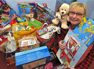 Sue Puntis collecting some of the gifts for Telford Young Carers