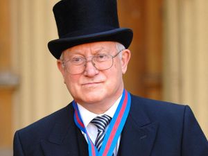 Oleg Gordievsky at Buckingham Palace after receiving the Companion of the Most Distinguished Order of St Michael and Saint George from the Queen