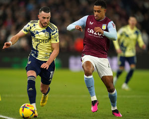 Leeds United's Jack Harrison and Aston Villa's Jacob Ramsey battle for the ball