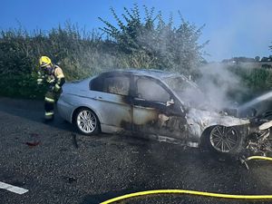 Supporting image for story: No injuries as dramatic car blaze closes Oswestry road