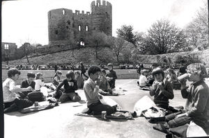 Children enjoying their picnic in the castle grounds during a school trip in 1974