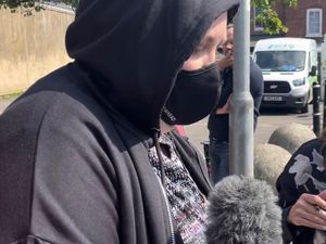 Holly LeGresley leaving court with her face covered