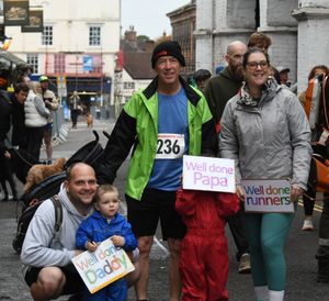 Jason Massey pictured with family and support banners.