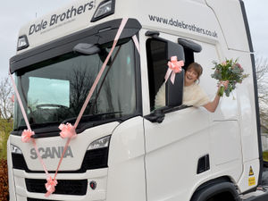 Supporting image for story: Blushing bride turns heads as she arrives at her wedding in lorry driven by her boss