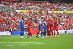 Walsall players crowd inside the box.