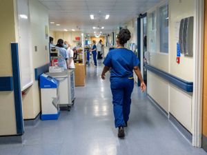Hospital staff in scrubs on a ward