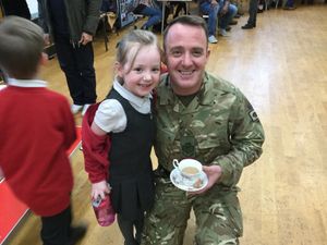 Supporting image for story: Kids welcome home hero military parents at Market Drayton school