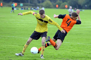 Jordan Bannister and Brian Herbert battle for the ball during Rock Rovers' impressive 6-3 away-day success.
