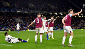 Chelsea's Callum Hudson-Odoi (left) goes down in the penalty area