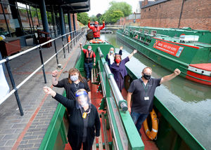 Staff celebrate the reopening of the boat trips