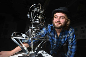 Artist Edward Cartwright with another example of his cutlery-inspired sculptures