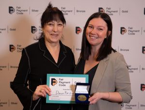 Pictured L to R: Liz Barclay, Small Business Commissioner, presents Katrina Gibson, Director of DellaPip, with a Fair Payment Code (FPC) Gold Award.