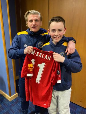Jason Cummings and nephew Jude with Mo Salah's shirt after the FA Cup tie against Liverpool