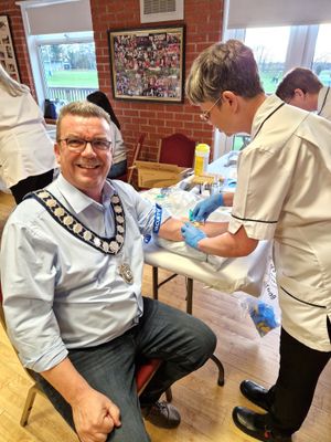 Former Whitchurch mayor Andy Hall receives his test during a PSA screening session organised by the Rotarians