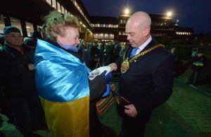 Greg Brackenridge put moneys into the collection box, held by Slava Madylus.