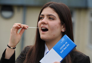 Rosa Shadforth-Groucutt, 16, with a Covid-19 self test kit