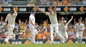 Australia's Mitchell Johnson (centre right)celebrates taking the wicket of England's Graeme Swann (centre) for 0