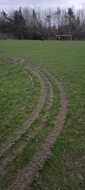 Vertical image of tread marks on the Pavilion field. Picture: Hollinswood & Randlay Parish Council