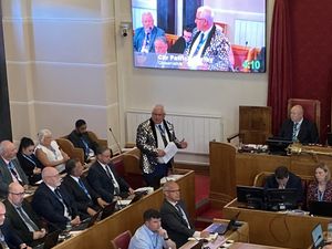 Cllr Patrick Harley on his feet during a full council meeting in April wearing a jacket he won in an auction at the mayor\'s ball. Picture Martyn Smith/LDRS free for LDRS use