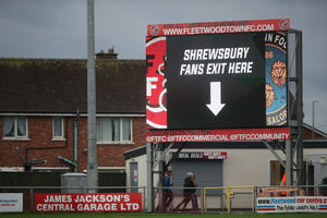 Shrewsbury Town head for the exits after the defeat. (AMA)