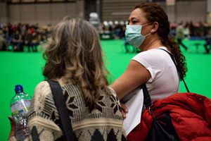 A lady wears a face mask at the Birmingham National Exhibition Centre (NEC) during the third day of the Crufts Dog Show. PA Photo. Issue date: Saturday March 7, 2020. See PA story ANIMALS Crufts. Photo credit should read: Jacob King/PA Wire.