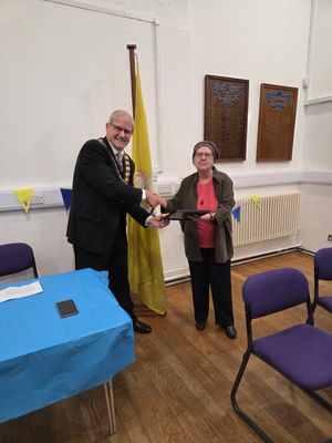 Wem's mayor, Councillor David Parry, presents Shelagh Richardson with her award