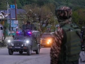 Indian security officers patrol in armoured vehicles near Pahalgam in south Kashmir