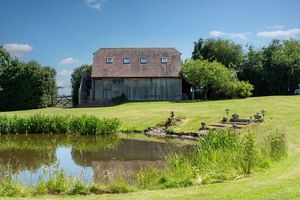 The home boasts expansive grounds featuring a pond and a boat house. Picture: Rightmove/Peter James Property Ltd.