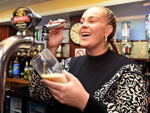 People at West End Working Men's Club, Wolverhampton, celebrate the fact that the pints are only £1.95..Grace Lawton pulls one of the pints..